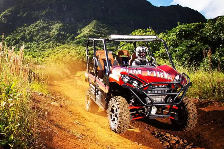 UTV driver on rocky dirt path in Hawaii